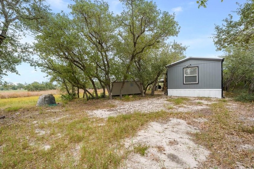 Nestled on wooded land along a quiet road, this newer - photo 27