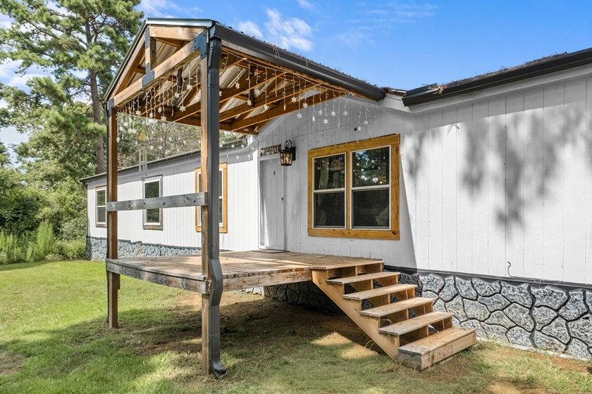 Tucked away among nearly 39 acres of towering timber, this East - photo 4