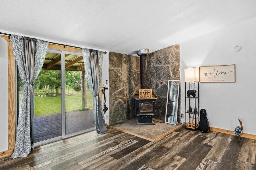 Tucked away among nearly 39 acres of towering timber, this East - photo 7