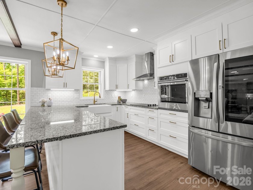 This newly renovated brick ranch home is hidden and secluded - photo 12