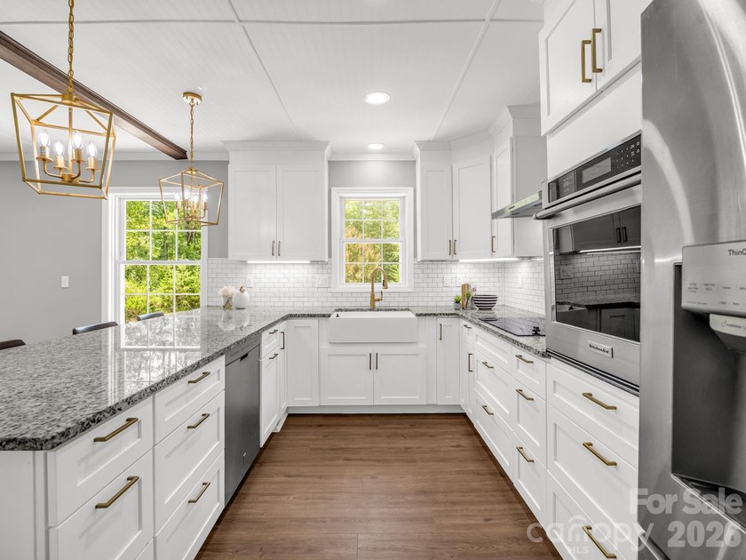 This newly renovated brick ranch home is hidden and secluded - photo 13