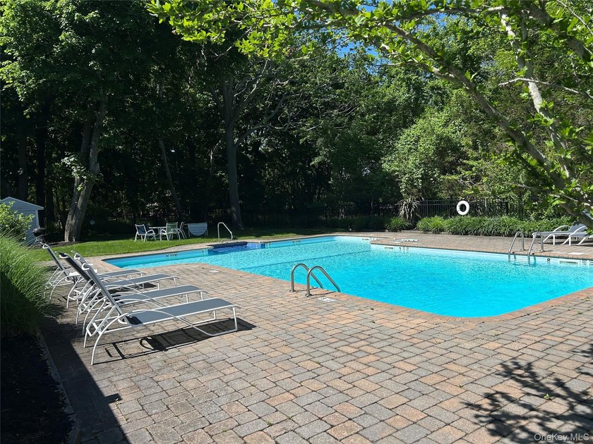 This inviting second-floor condo in Westhampton offers a - photo 12