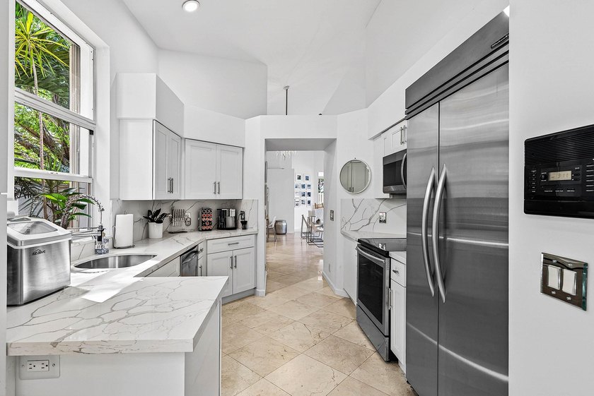 Updated 3 BD 3 BA home with bright, inviting living spaces and - photo 7