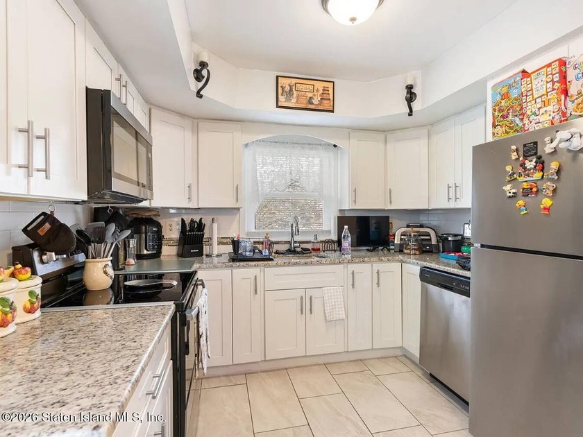 Welcome to 4 Cottage Avenue, a fully detached two-family home - photo 7