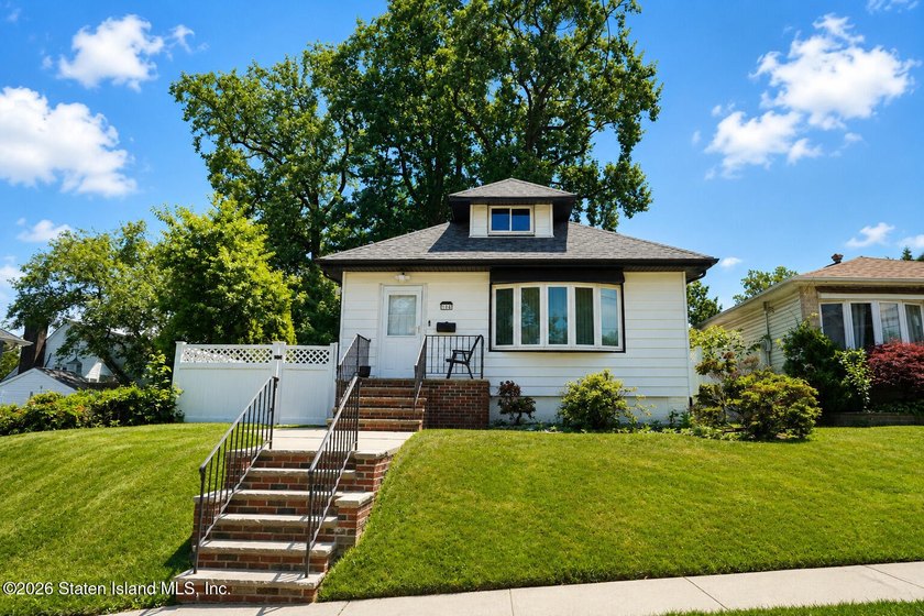 Welcome to 106 Hillcrest Avenue, a single-family detached raised - photo 4