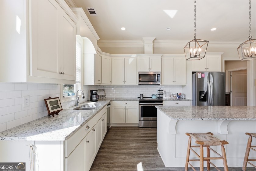 Welcome to this spacious 4 bedroom, 3 bath home in the highly - photo 9