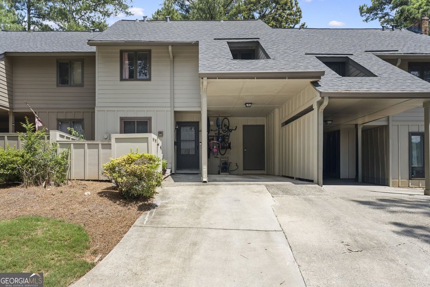 Welcome to this inviting end-unit townhome nestled in the highly - photo 2