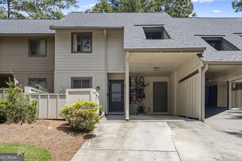 Welcome to this inviting end-unit townhome nestled in the highly - photo 3