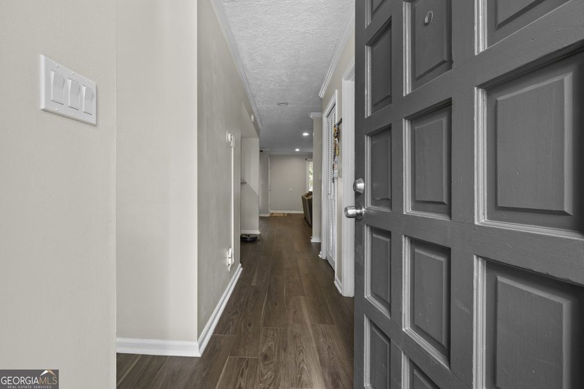 Welcome to this inviting end-unit townhome nestled in the highly - photo 5
