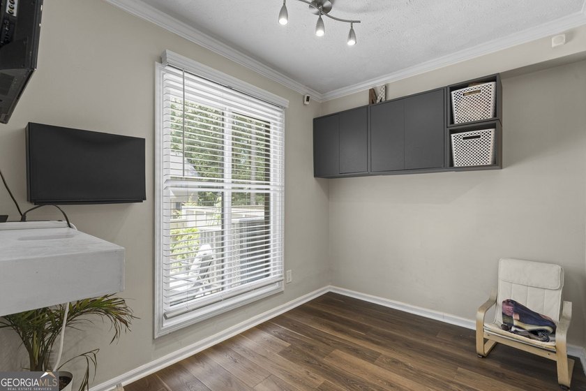 Welcome to this inviting end-unit townhome nestled in the highly - photo 7