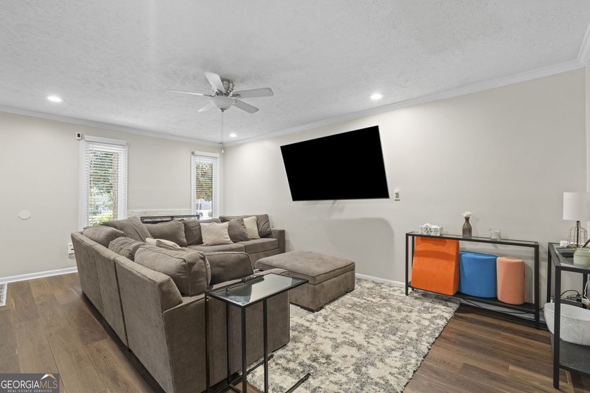 Welcome to this inviting end-unit townhome nestled in the highly - photo 9