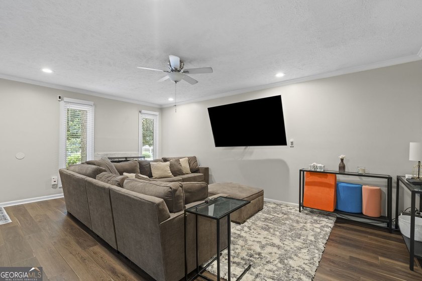 Welcome to this inviting end-unit townhome nestled in the highly - photo 10
