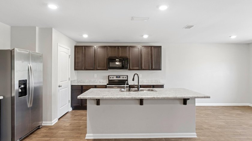 Welcome to a beautifully maintained 4-bedroom, 2-bath home in - photo 4