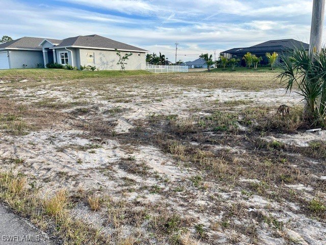 This cleared lot is located amongst large, newer homes - photo 4