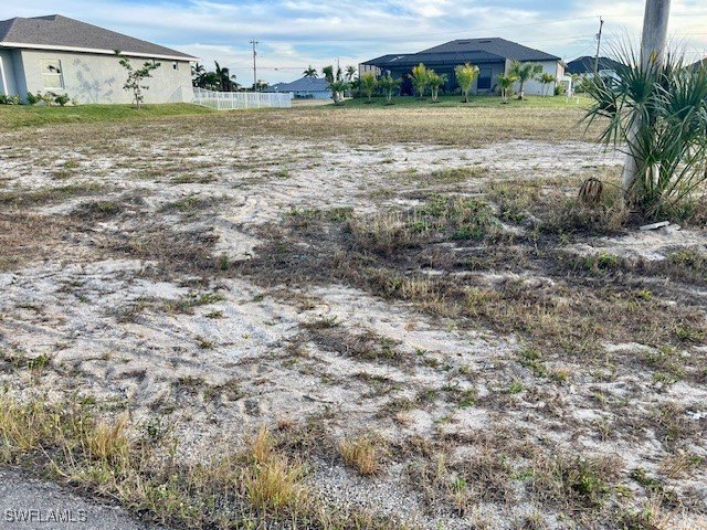 This cleared lot is located amongst large, newer homes - photo 5