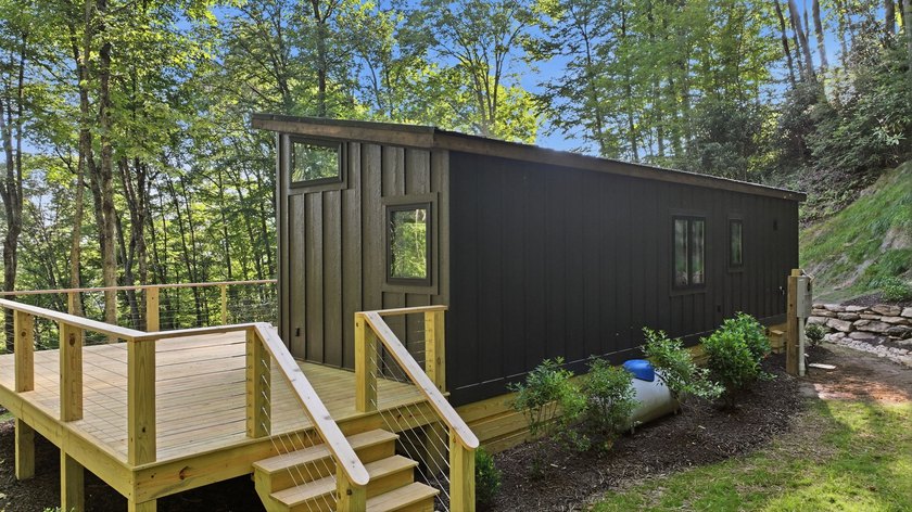 Perched on 1.12 private acres, this custom-built Timbercraft - photo 5