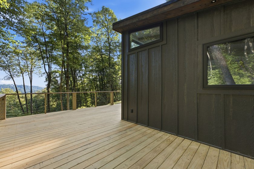 Perched on 1.12 private acres, this custom-built Timbercraft - photo 9