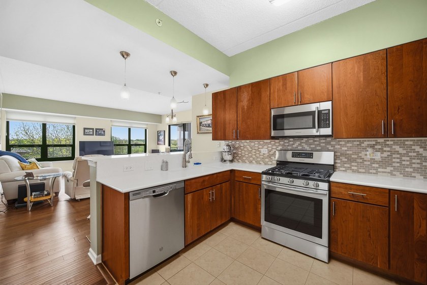 This move-in-ready luxury condo offers the perfect blend of - photo 4