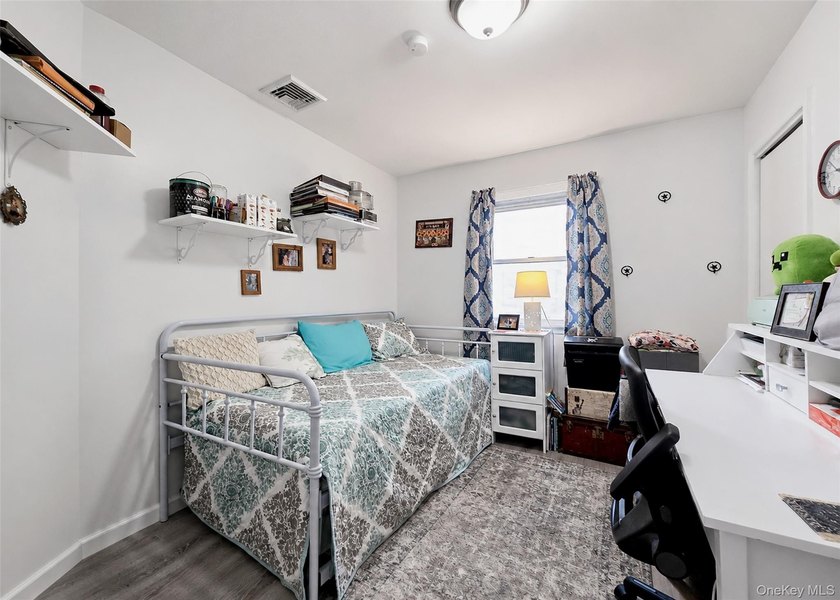 Spacious and open floor plan with cathedral ceilings welcome you - photo 8