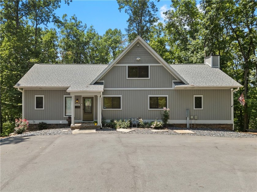 Experience exceptional lakefront living in this custom-built - photo 3