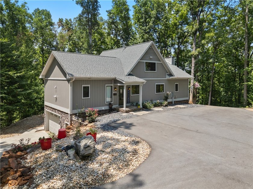 Experience exceptional lakefront living in this custom-built - photo 5