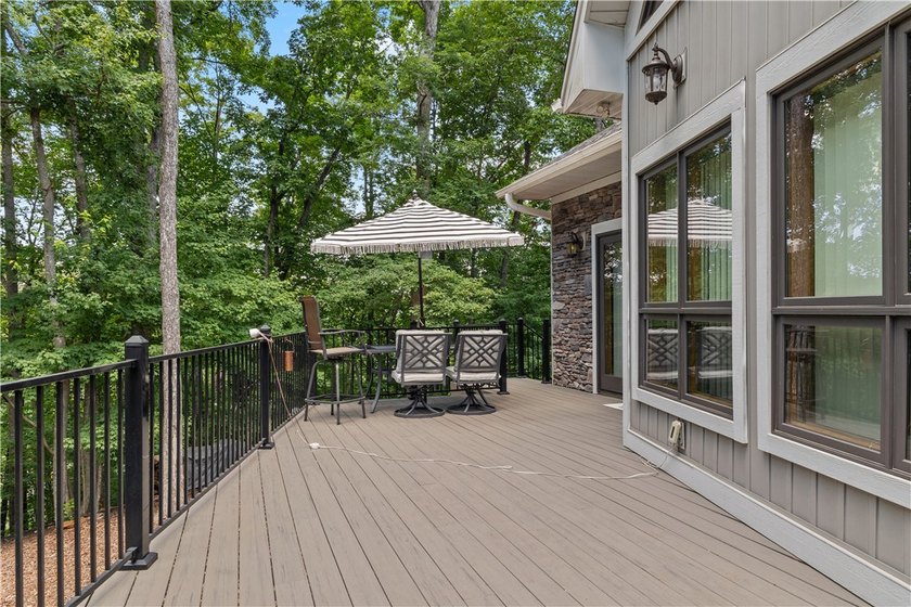 Experience exceptional lakefront living in this custom-built - photo 8