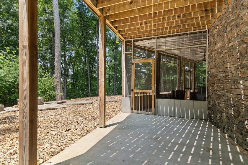 Experience exceptional lakefront living in this custom-built - photo 10