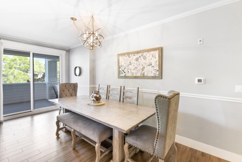 Perfectly positioned as a rare end-unit residence, this - photo 6