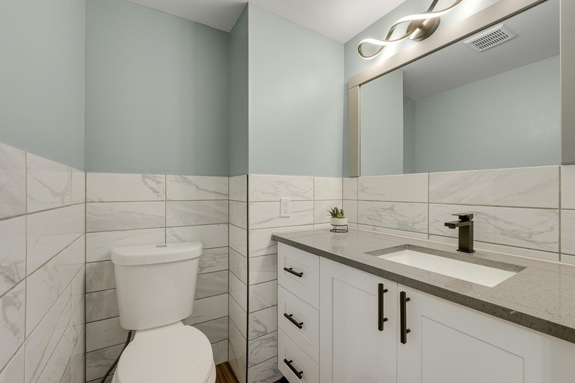 This stunning two-story residence has been completely remodeled - photo 13