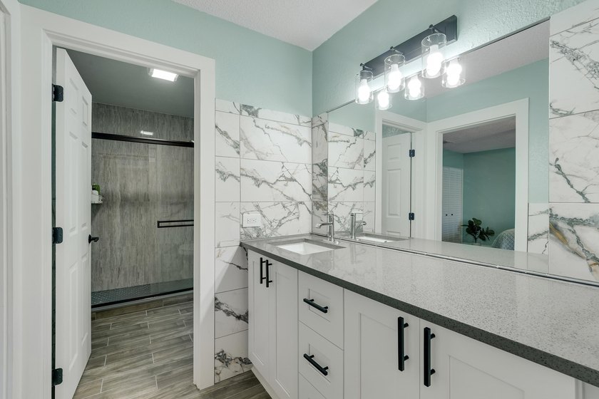 This stunning two-story residence has been completely remodeled - photo 20
