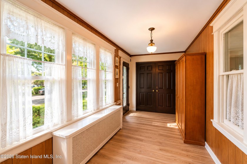 Welcome to 73 Walnut Street! Step into the inviting sunroom, a - photo 4
