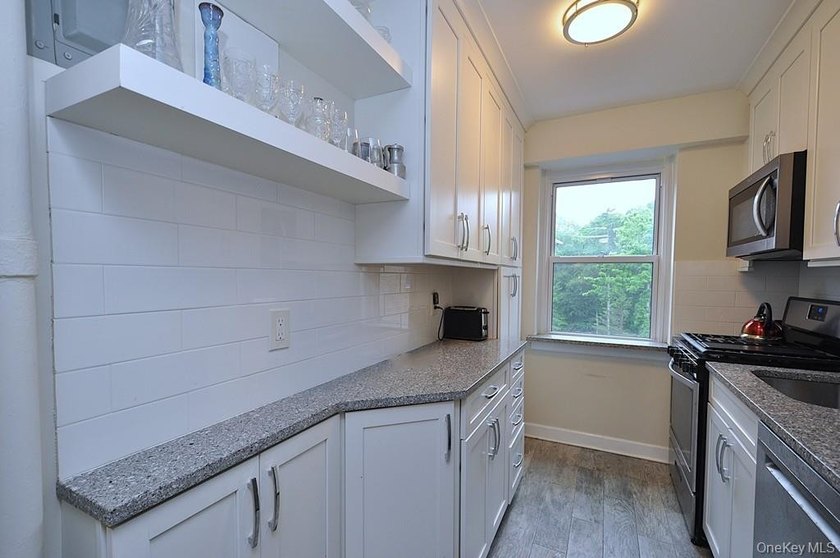Welcome home to this sun-drenched and beautifully spacious - photo 9