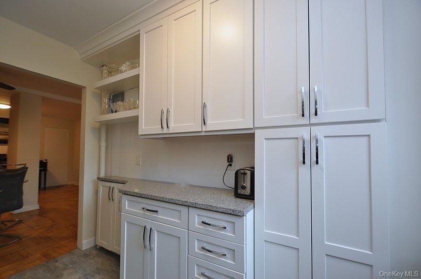 Welcome home to this sun-drenched and beautifully spacious - photo 10
