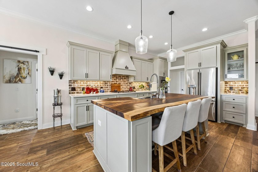 SHOWING LIKE A MODEL HOME, this exceptional custom-built - photo 14