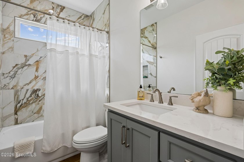 SHOWING LIKE A MODEL HOME, this exceptional custom-built - photo 32