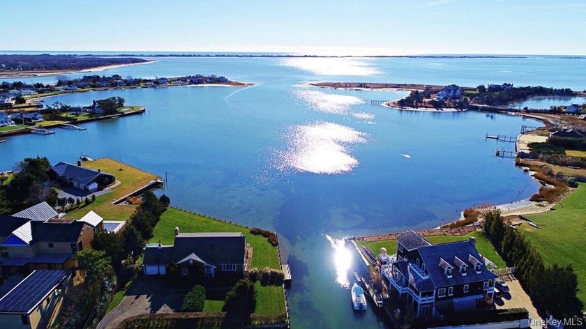 Set on 0.63 acres with waterside pool and 110Ft of bulkhead - photo 3