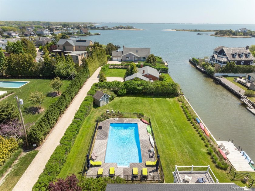 Set on 0.63 acres with waterside pool and 110Ft of bulkhead - photo 4
