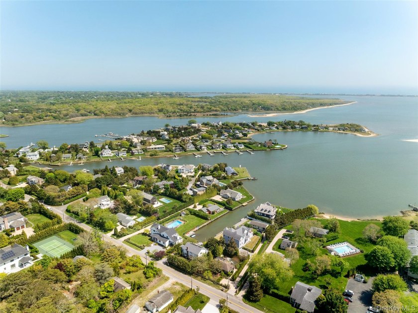 Set on 0.63 acres with waterside pool and 110Ft of bulkhead - photo 6