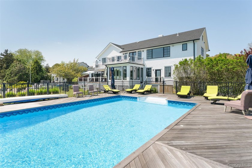 Set on 0.63 acres with waterside pool and 110Ft of bulkhead - photo 7