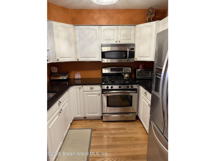 MOVE RIGHT INTO THIS BEAUTIFULLY MAINTAINED 2-BEDROOM FINISHED - photo 5