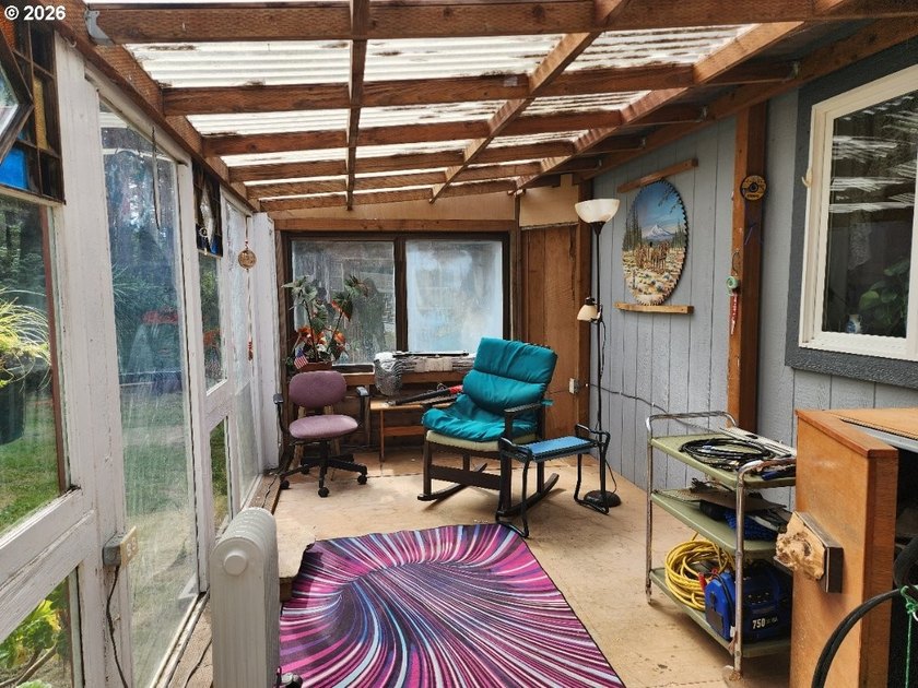 Tucked away among the trees on 1.16 private acres with a Large - photo 4