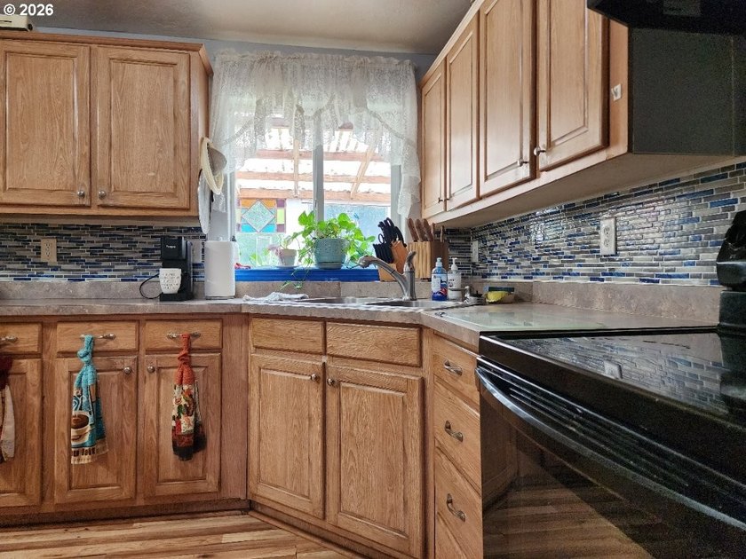 Tucked away among the trees on 1.16 private acres with a Large - photo 6