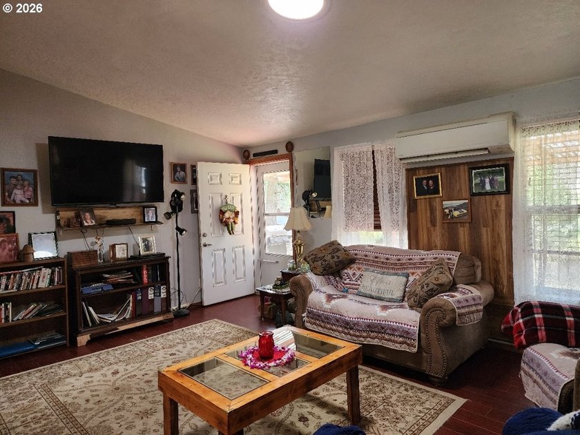 Tucked away among the trees on 1.16 private acres with a Large - photo 10