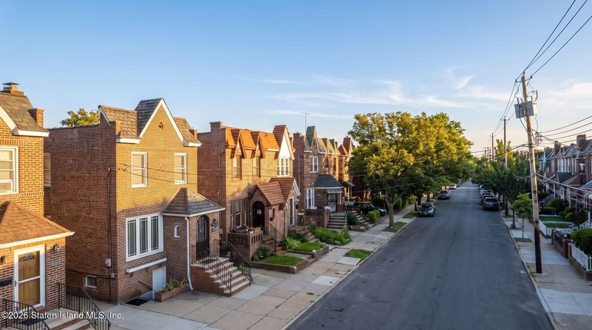 This is a beautifully renovated semi-attached brick - photo 2