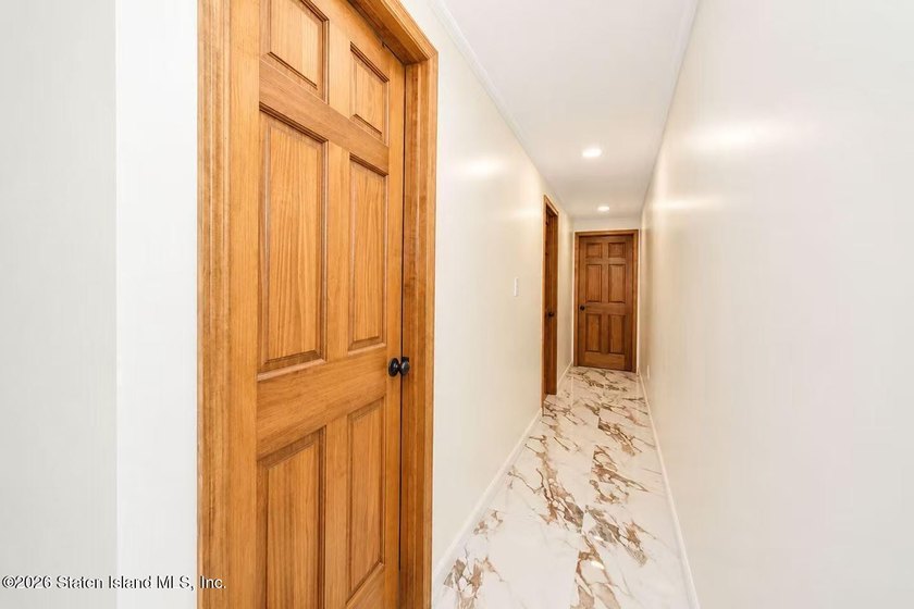 This is a beautifully renovated semi-attached brick - photo 8