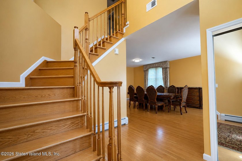 This gorgeous 2-family, 4-bedroom, 3-bathroom, side-hall - photo 4