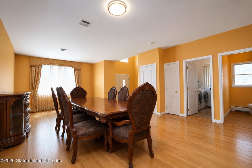 This gorgeous 2-family, 4-bedroom, 3-bathroom, side-hall - photo 7