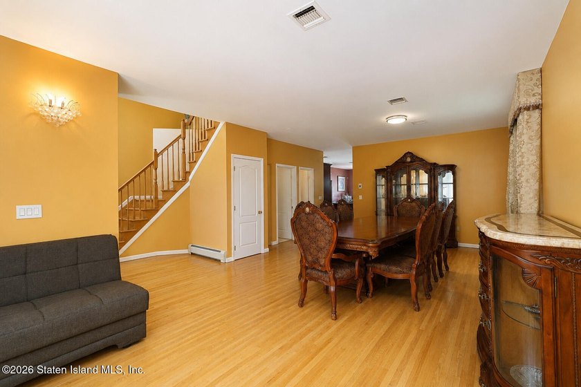 This gorgeous 2-family, 4-bedroom, 3-bathroom, side-hall - photo 8