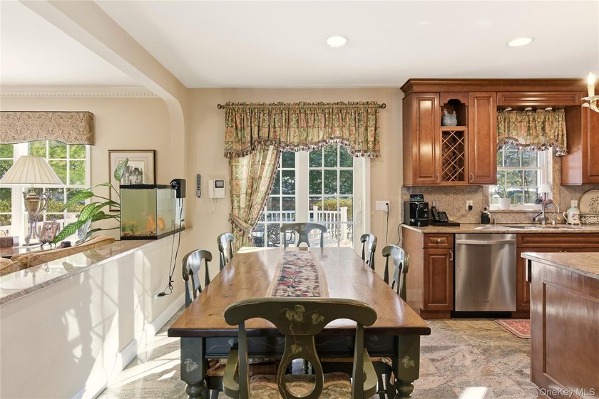 FLOWER HILL, ROSLYN | BRICK CENTER HALL COLONIAL. Located on a - photo 13