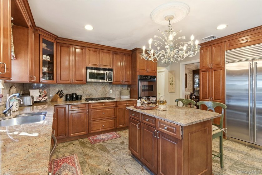 FLOWER HILL, ROSLYN | BRICK CENTER HALL COLONIAL. Located on a - photo 15